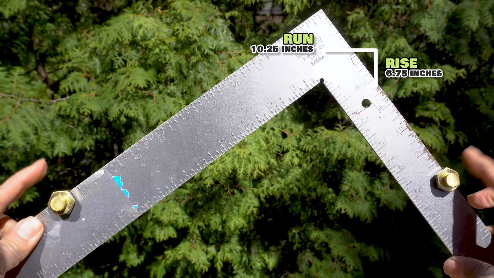Framing square set with rise and run stair gauges for deck stairs layout