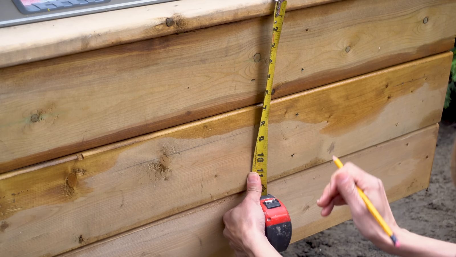 Measuring down the rim board and skirting to mark stringer layout