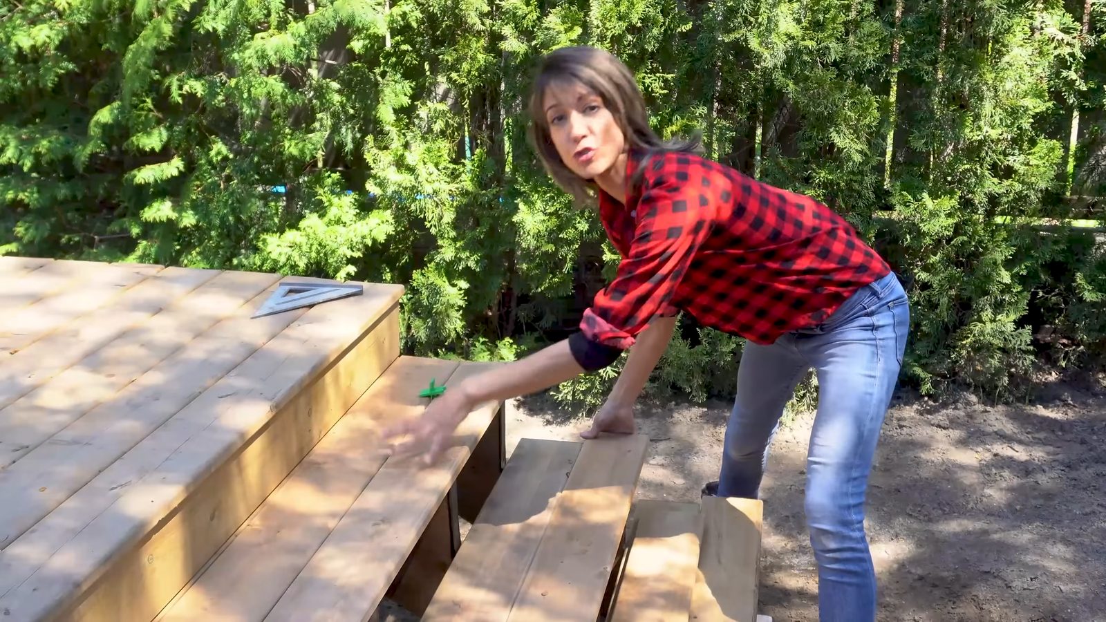 Installing deck board treads on the finished deck stair stringers