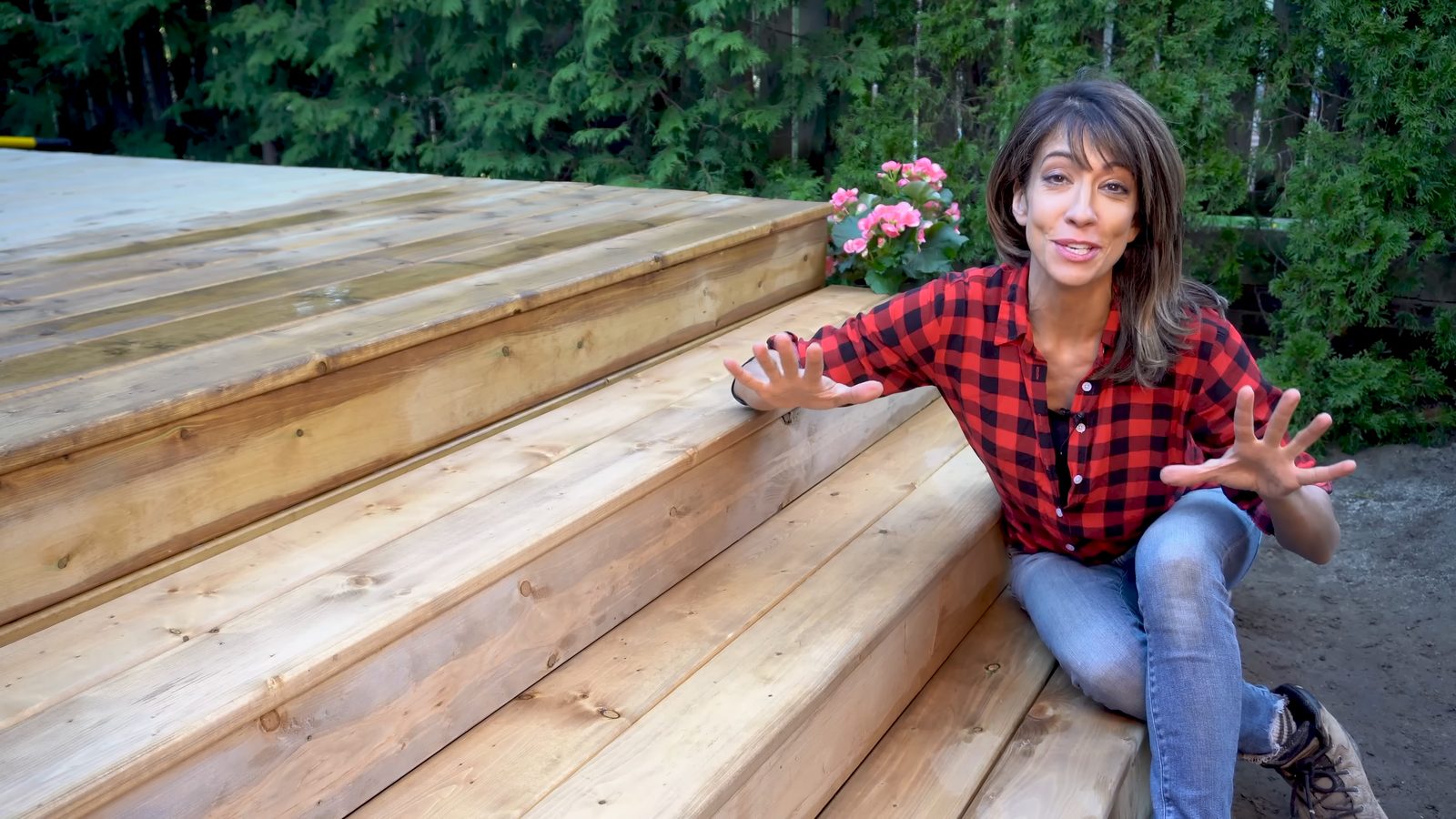 Wide shot of Daru Dhillon with the finished deck stairs