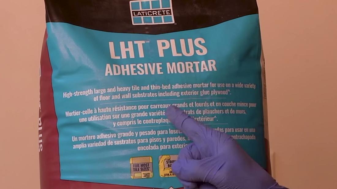 Close-up of a Laticrete LHT PLUS Adhesive Mortar bag, a high-strength modified thin-bed mortar for heavy tile and curbless shower bases