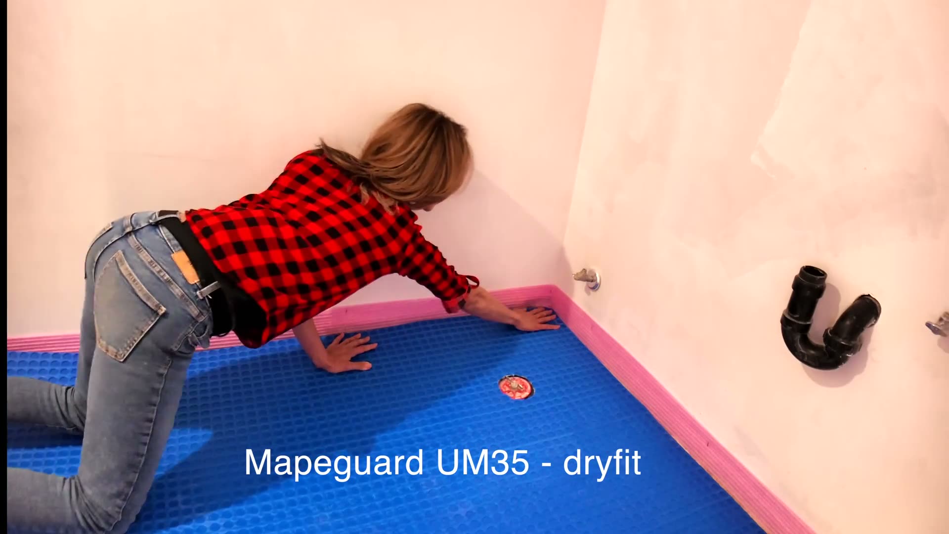 Dry fitting Mapeguard UM 35 on a concrete slab with the cut-out made before any mortar goes down