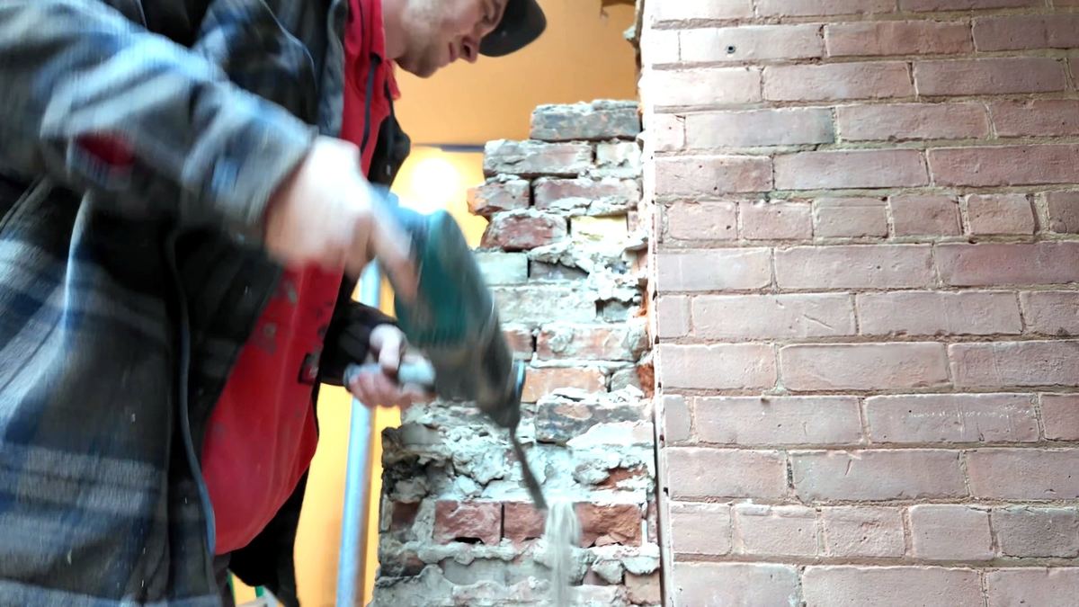 Breaking out remaining brick from the interior with an SDS hammer drill and chisel bit