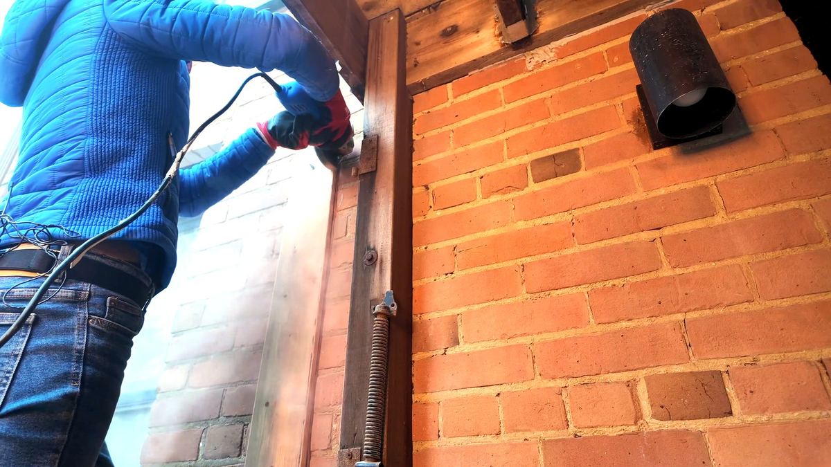 Cutting a kerf in brick with an angle grinder along a straight guide board
