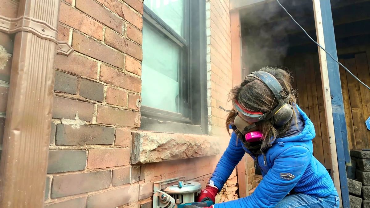 Finishing a masonry cut with a circular saw riding in the grinder kerf
